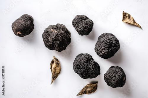 Black truffle gourmet mushrooms on white stone background, top view flat lay. Generative AI