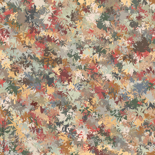  Abstract autumn grass. Spotted design in camouflage style. Seamless repeating pattern with jagged edge irregular geometric elements in different shades of green and brown. Vector image.