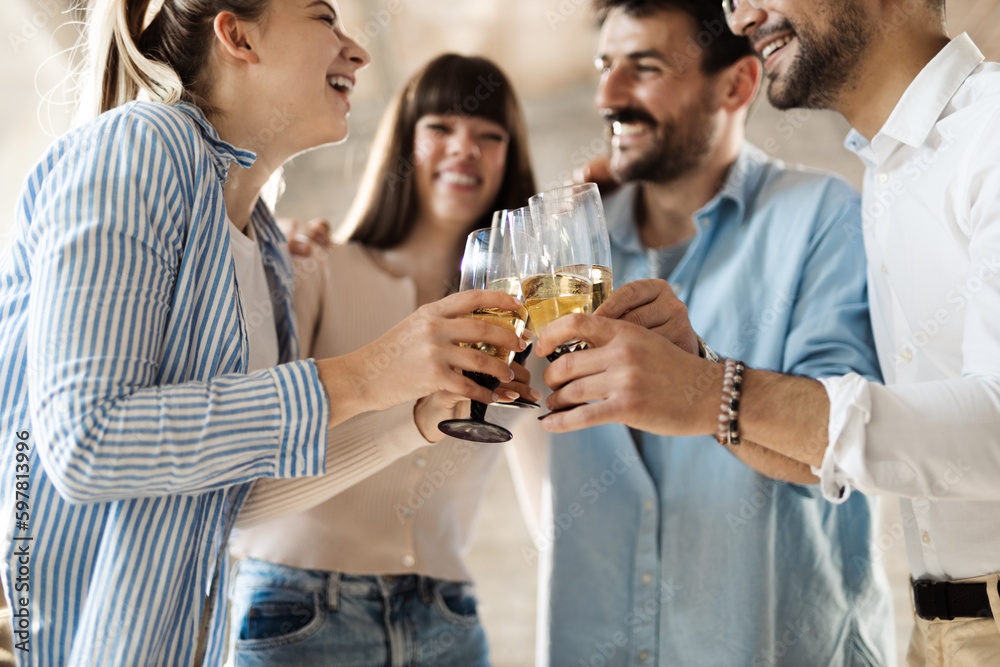 Close up of happy business people toasting with wine at office party Close up of happy business people toasting with wine at office party