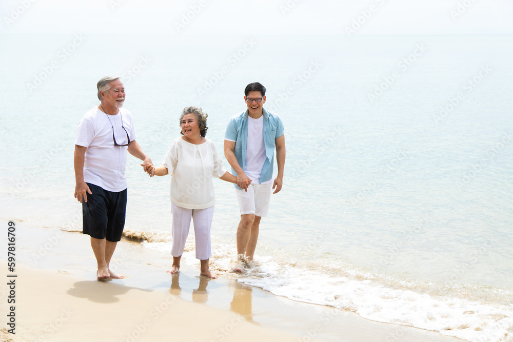 Happy asian family on the beach summer vacation. Vacation summer beach holidays background Happy asian family on the beach summer vacation. Vacation summer beach holidays background
