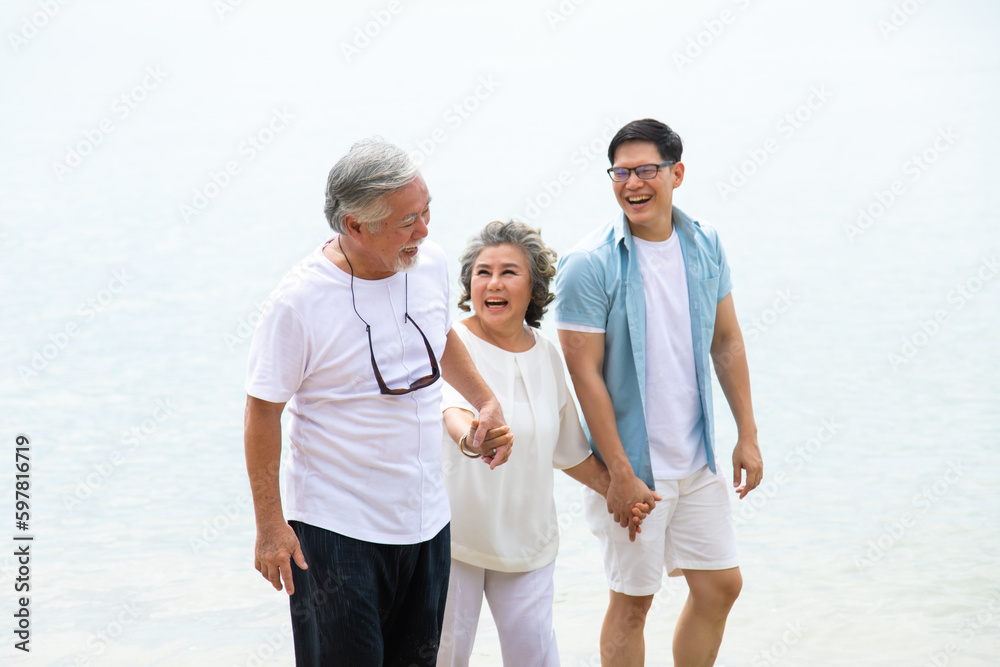 Happy asian family on the beach summer vacation. Vacation summer beach holidays background Happy asian family on the beach summer vacation. Vacation summer beach holidays background