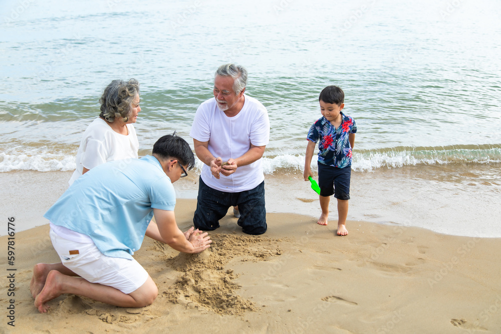 Happy asian family spending time together on the beach summer vacation.