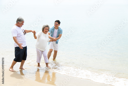 Happy asian family on the beach summer vacation. Vacation summer beach holidays background