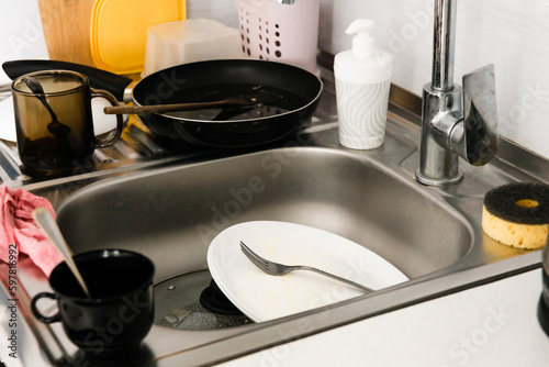 Dirty dishes in the sink. Cleaning concept