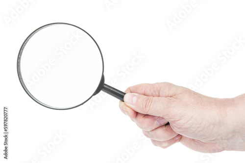 Magnifying lens in hand close up on a white background