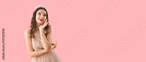 Beautiful young woman in stylish prom dress on pink background with space for text