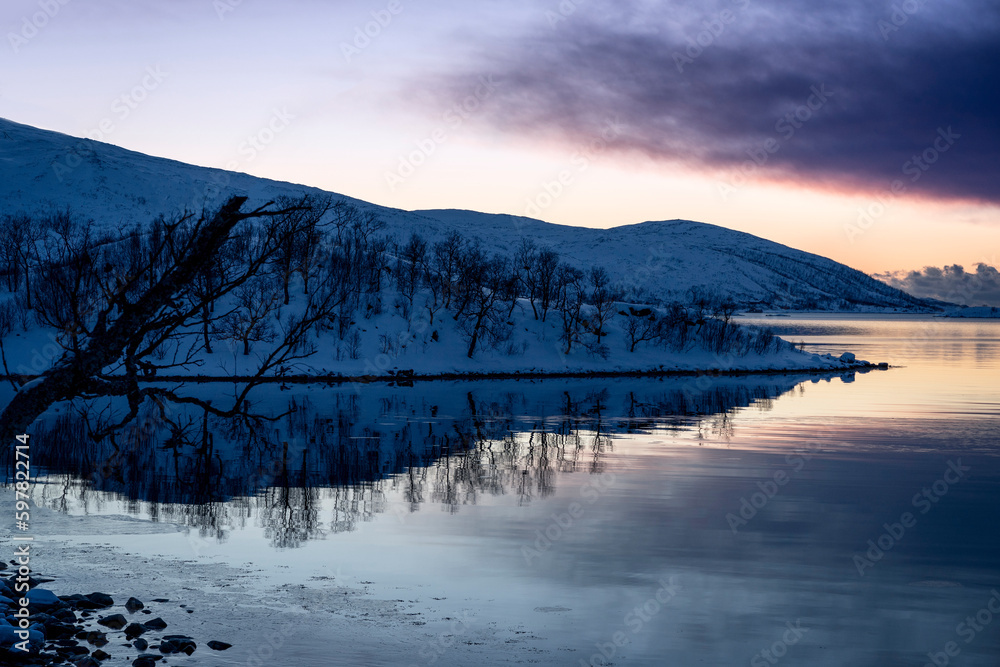 snowy landscape at sunset in coasline of tromso