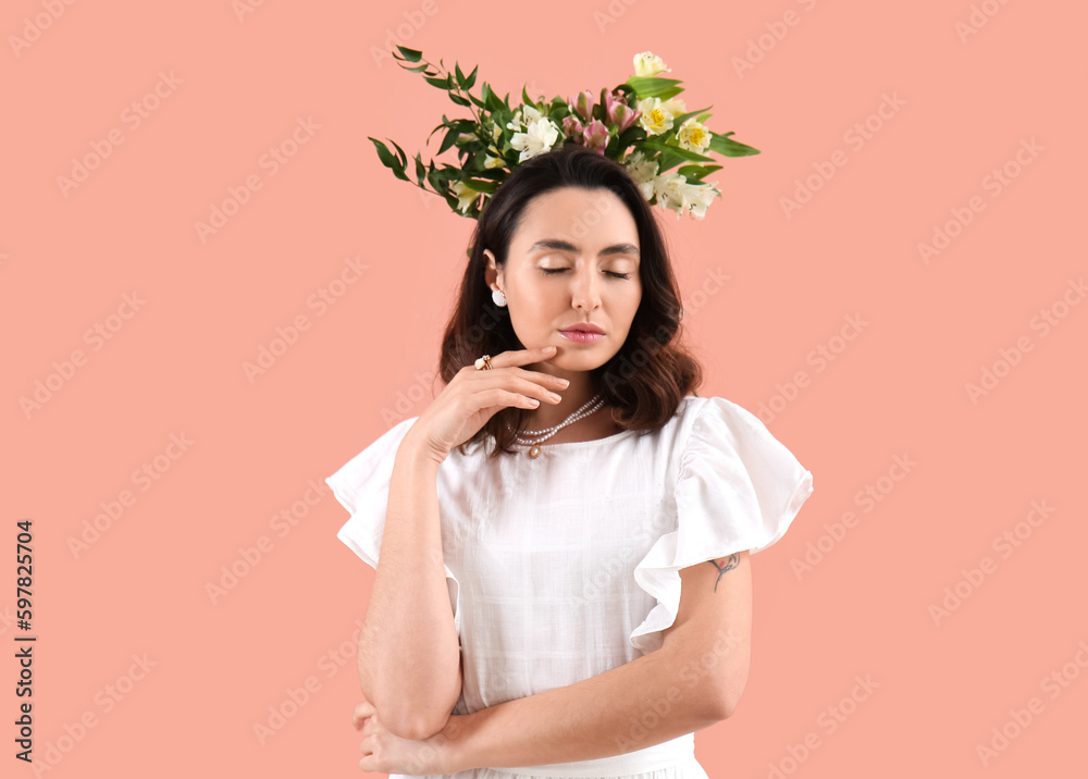 Young woman in dress with alstroemeria flowers on pink background Young woman in dress with alstroemeria flowers on pink background