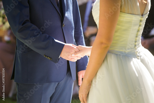 Intimate Moment of a couple Exchanging Wedding Rings at a wedding © Dewald