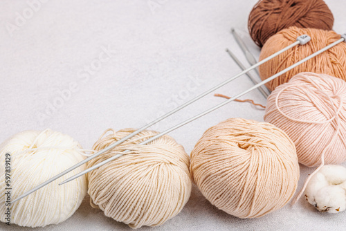 A set of pastel natural colors clews of thread for knitting and craft tools. Handmade, hobby concept