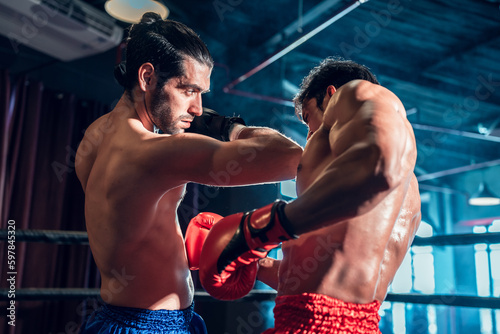 Two athlete men training boxing at muay thai gym. Active male workout sport club for cardio and body strength. Health and lifestyles concept. © Platoo Studio