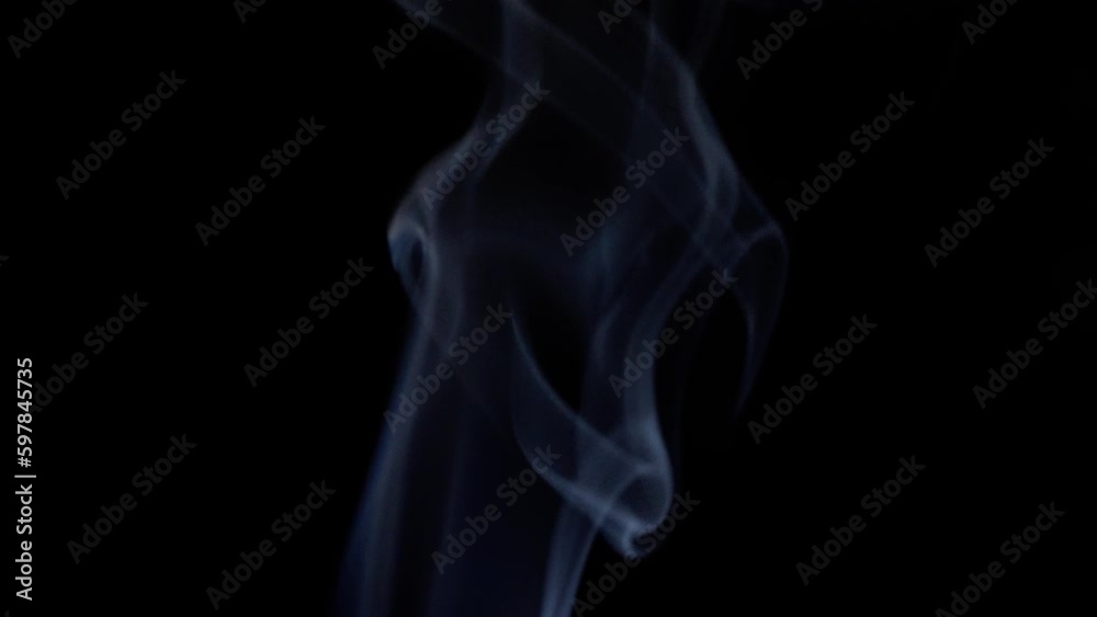 smoke of burning incense stick blowing away -black background (4k - slow motion)[ high quality ]
