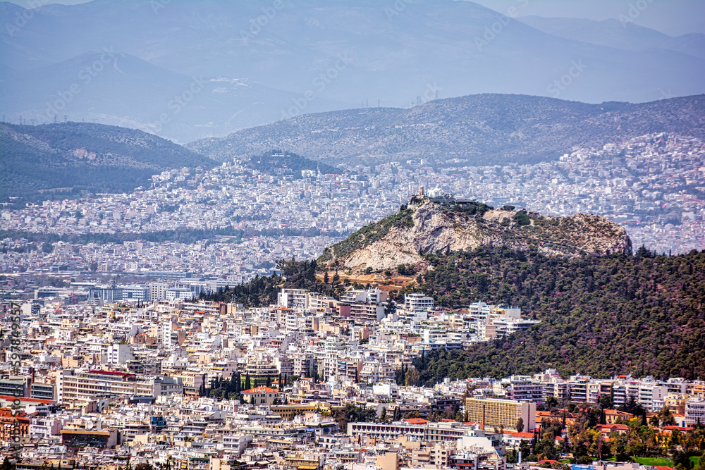 Panorama of Athens, view of Lycabettus Mount from Hymettus Mountain. Cityscape of Athens with old and modern Greek houses.