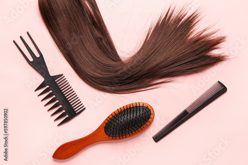 Brown hair with brushes on pink background