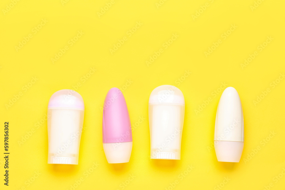 Different deodorant bottles on yellow background Different deodorant bottles on yellow background