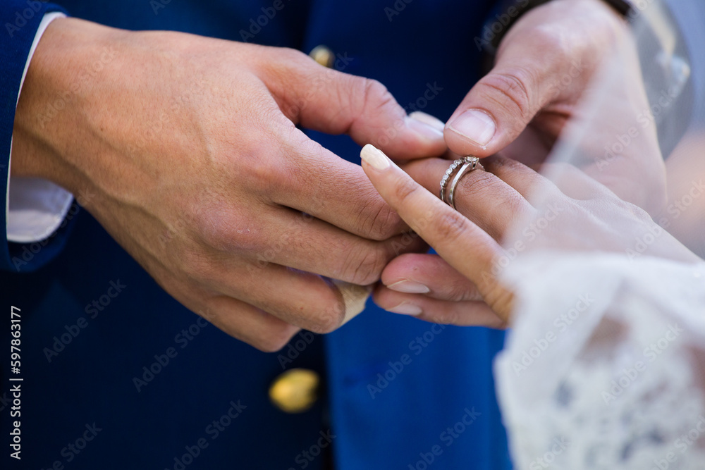 Intimate Moment of a couple Exchanging Wedding Rings at a wedding Intimate Moment of a couple Exchanging Wedding Rings at a wedding