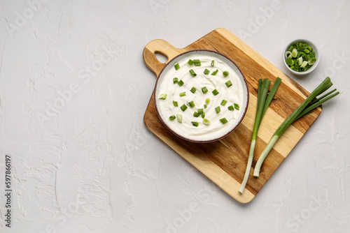 Bowl of tasty sour cream wi...