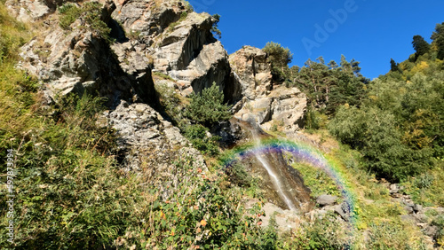 mountain ridge woods waterfall with rainbow at summer, tripper experience - photo of nature