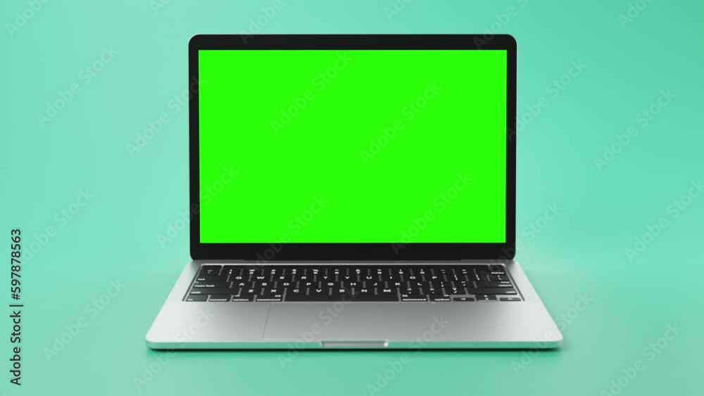 modern laptop with green screen on display for footage placement.