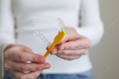 Cleaning plastic aligner aligners with a toothbrush 