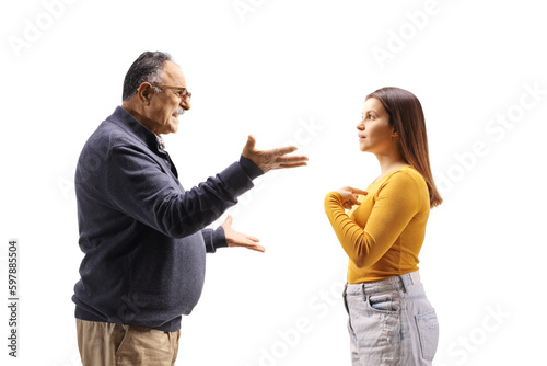 Profile shot of an angry mature man having an argument with his daughter photo