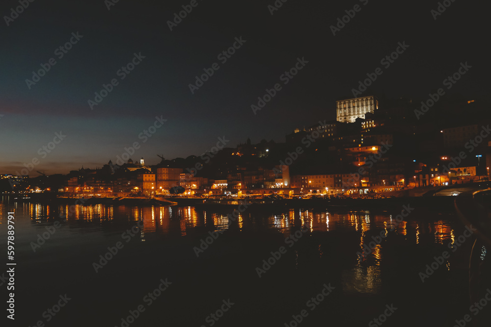 night panorama view of the Porto cityscape by Douro river
