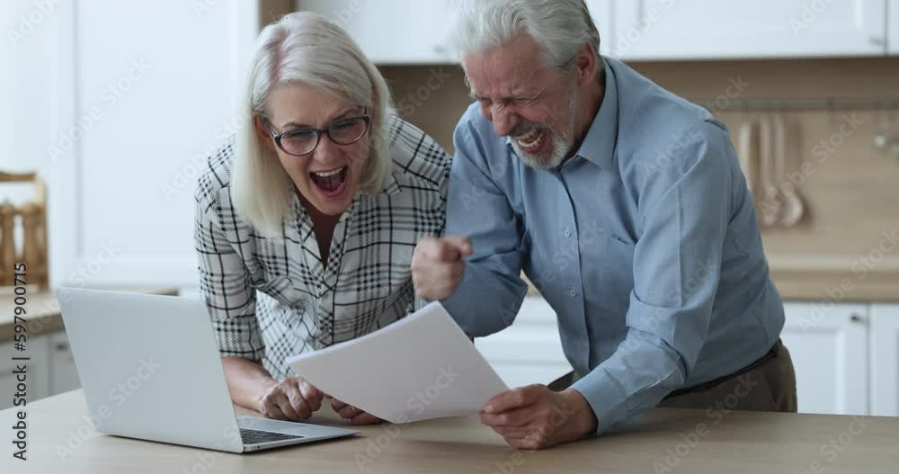 Overjoyed retired elderly couple read document, enjoy unbelievable news, bank notice of loan repayment, money back, laugh and screaming with joy. Celebrate financial success, pension Generative AI Overjoyed retired elderly couple read document, enjoy unbelievable news, bank notice of loan repayment, money back, laugh and screaming with joy. Celebrate financial success, pension Generative AI