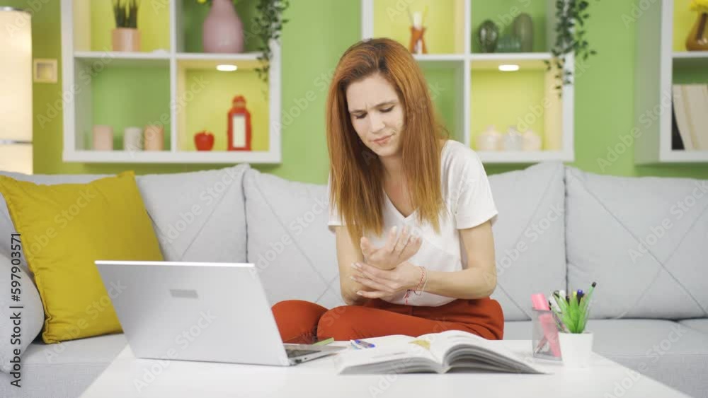 Home Office worker woman's hands hurt from working hard. Home Office worker woman's hands hurt from working hard.