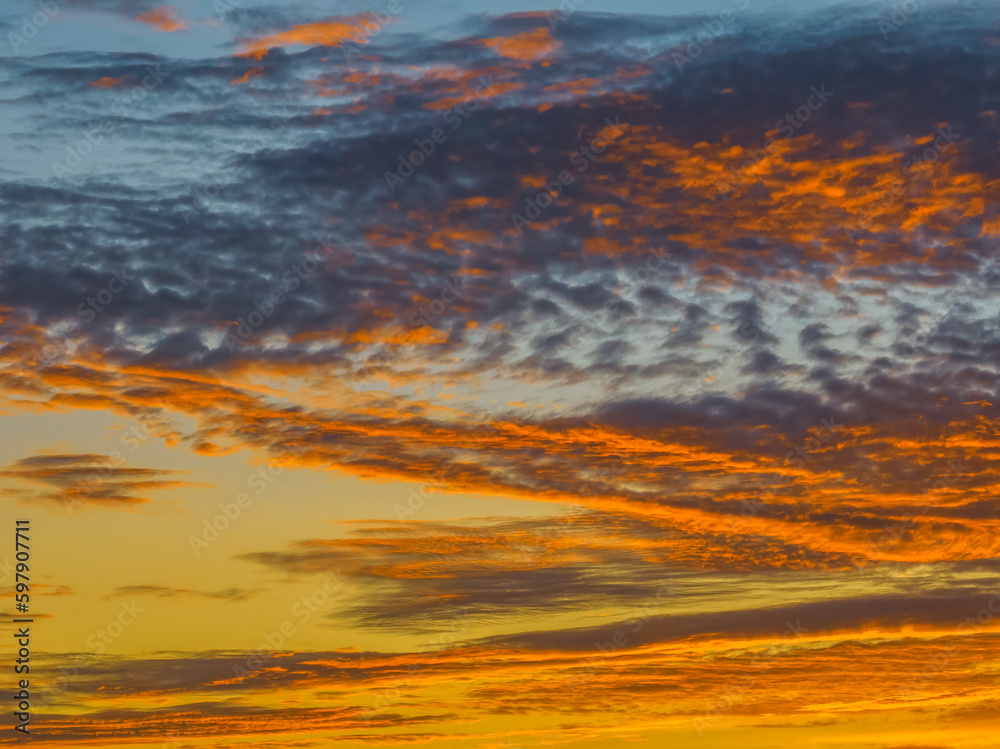 Sunrise cloudscape in shades of purple and orange Sunrise cloudscape in shades of purple and orange