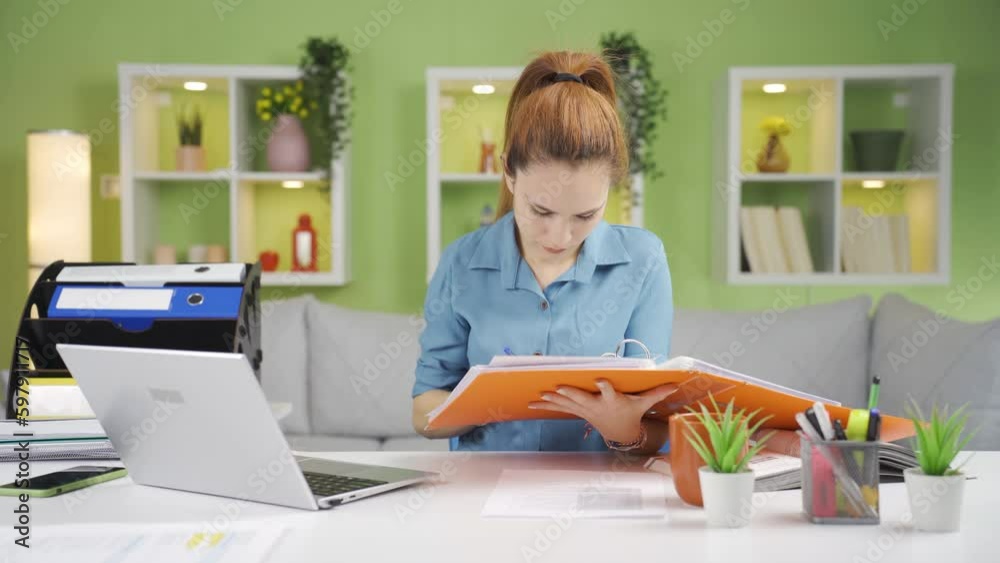 Happy and positive business woman working at her desk. Happy and positive business woman working at her desk.