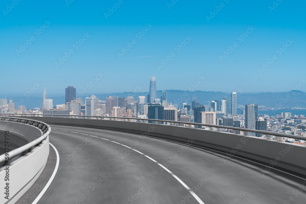 Empty urban asphalt road exterior with city buildings background. New modern highway concrete construction. Concept way to success. Transportation logistic industry fast delivery. San Francisco. USA. Empty urban asphalt road exterior with city buildings background. New modern highway concrete construction. Concept way to success. Transportation logistic industry fast delivery. San Francisco. USA.