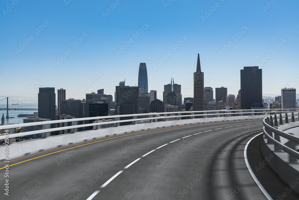 Empty urban asphalt road exterior with city buildings background. New modern highway concrete construction. Concept way to success. Transportation logistic industry fast delivery. San Francisco. USA.