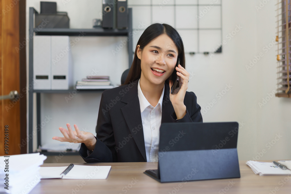 Work of secretary concept, Female secretary talks on phone to explaining business data to executive Work of secretary concept, Female secretary talks on phone to explaining business data to executive