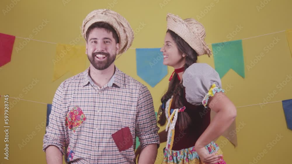 Brazilian couple, dressed in Junina party clothes, São João party. Protocol scenes.