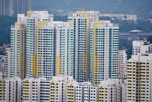high angle view of singapore residential buildings against blue sky 