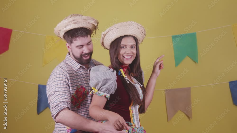Brazilian couple, dressed in Junina party clothes, São João party. Protocol scenes.