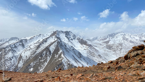 Panorama of snow-capped mountains. Beautiful mountain landscape. Natural calm background.