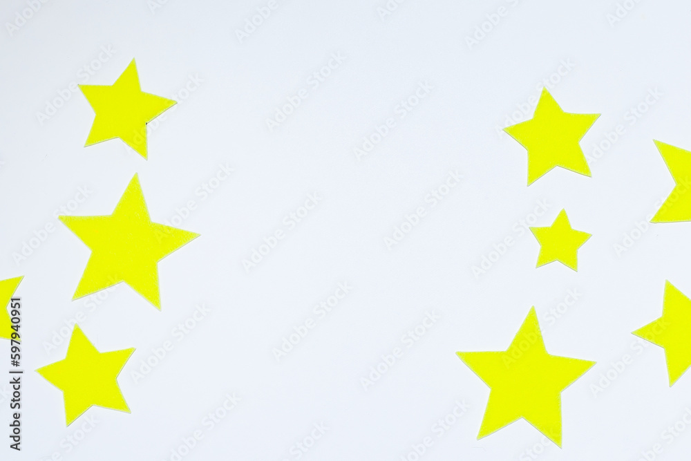 Yellow felt stars of different sizes on a white background. isolate Yellow felt stars of different sizes on a white background. isolate