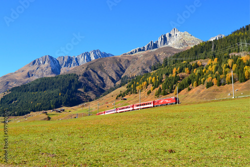 The MGB (Matterhorn - Gotthard - Bahn) train in the Andermatt Sedrun Disentis region photo