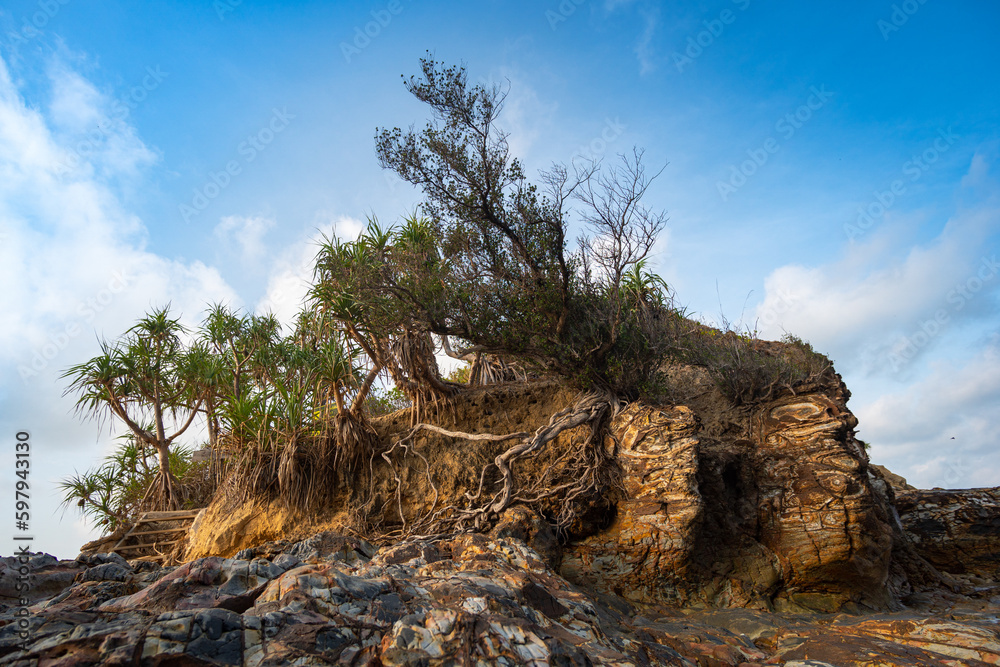The island where the lighthouse is located There is an unusual rock formation with colorful round stones of various sizes filling the beach below. .Lanta lighthouse is popular landmark of Krabi. The island where the lighthouse is located There is an unusual rock formation with colorful round stones of various sizes filling the beach below. .Lanta lighthouse is popular landmark of Krabi.
