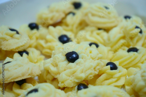 Closeup Kue Semprit with foreground and background. Cookies are often served during Eid Ul Fitr or Eid or Eid Mubarak photo