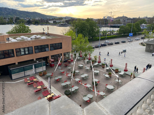 Scenic view from balcony over City of Zürich with Lake Zürich and local mountain Uetliberg and beautiful sunset on a spring evening. Photo taken April 29th, 2023, Zurich, Switzerland. photo