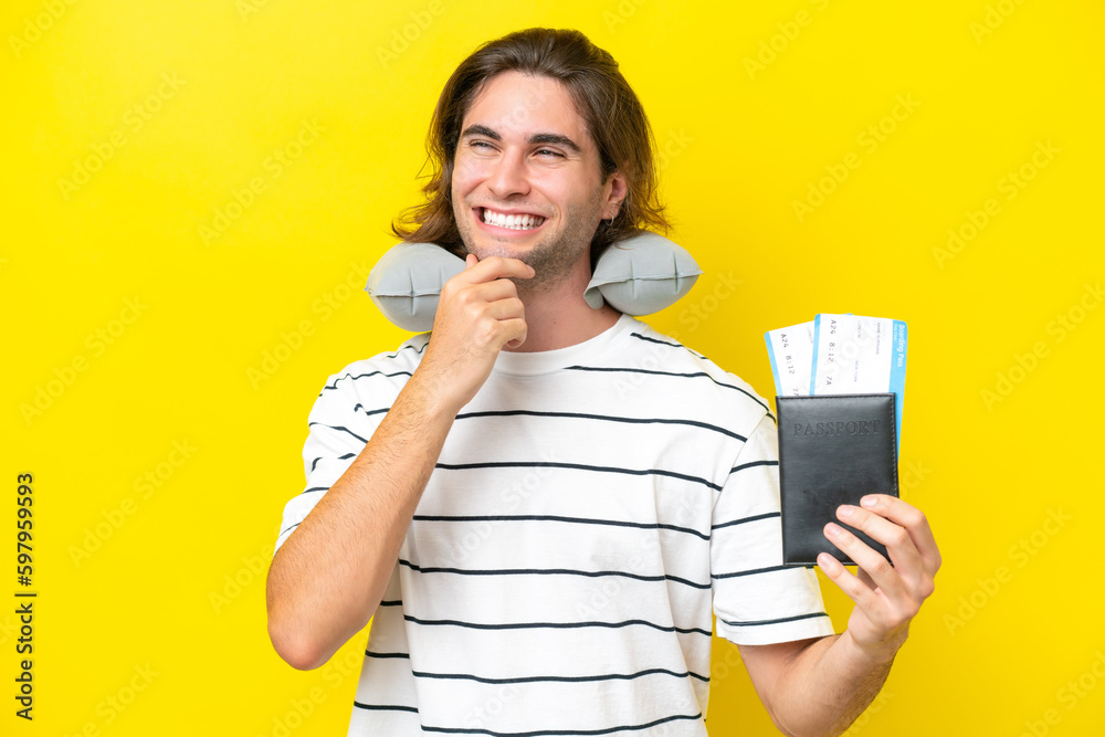handsome Man with Inflatable Travel Pillow looking to the side and smiling handsome Man with Inflatable Travel Pillow looking to the side and smiling