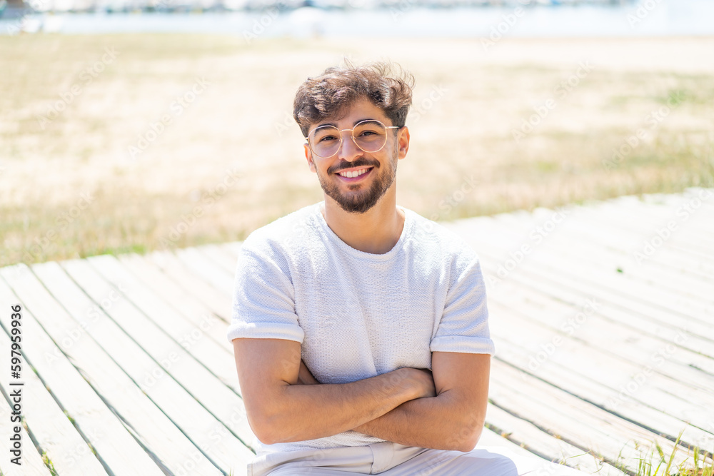 Handsome Arab man at outdoors With glasses with happy expression Handsome Arab man at outdoors With glasses with happy expression