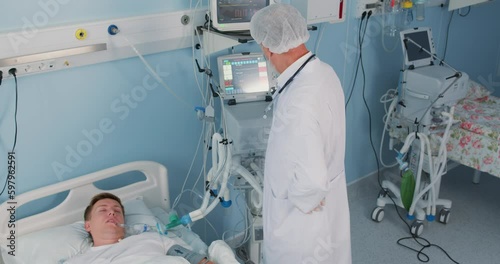 professional old doctor and nurse giving high-five to each other smiling at hospital. successful surgeon , operating in hospital. medical staff is happy as their patient is recovering Success, victory