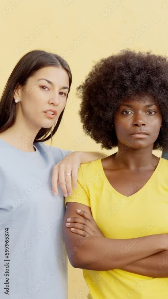 Serious women looking at camera. Vertical video Serious women looking at camera. Vertical video