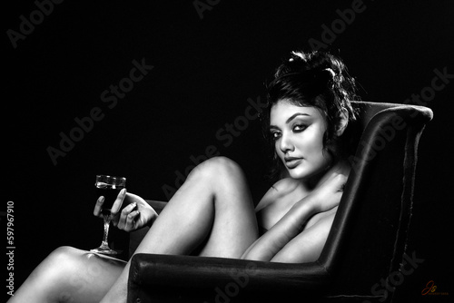 semi-nude portrait of a woman with wine