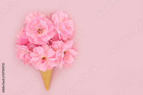 Rose flower surreal ice cream waffle cone design on pink background. Summer flowers minimal abstract floral creative art trendy concept. For Valentines  wedding  Mothers Day  anniversary or birthday d