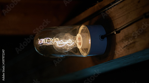 a light bulb in a dark hut