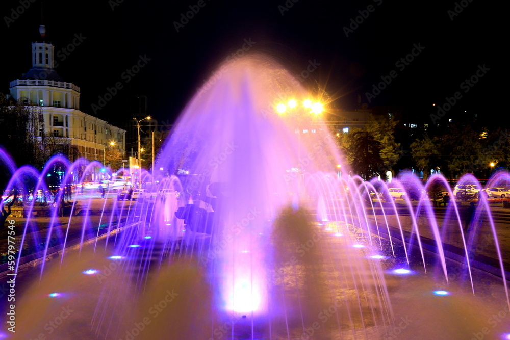 Fountain with colorful illumination at night, Creative water design. Ukraine, Dnipro